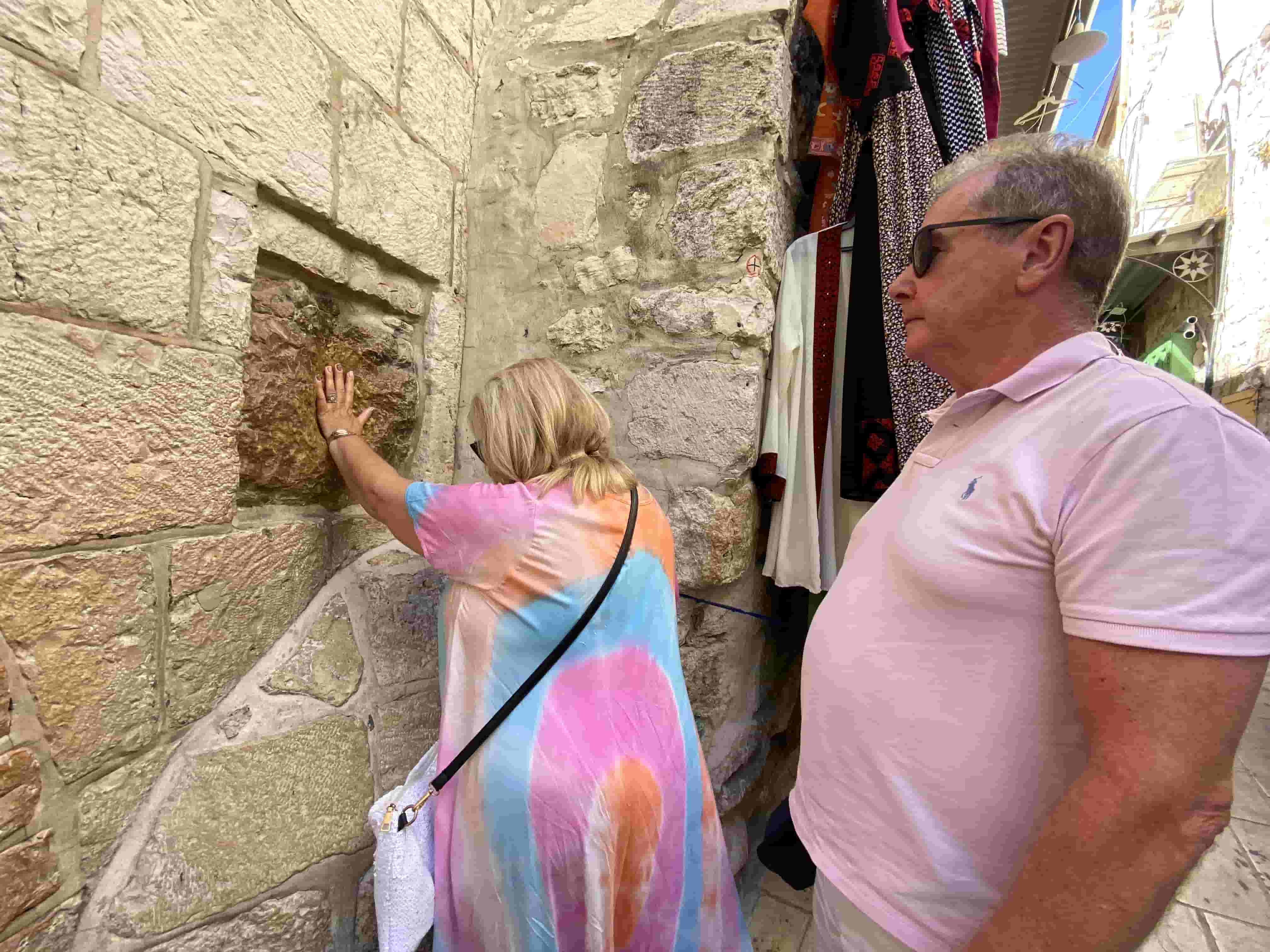 via dolorosa street in jerusalem with a tour guide 